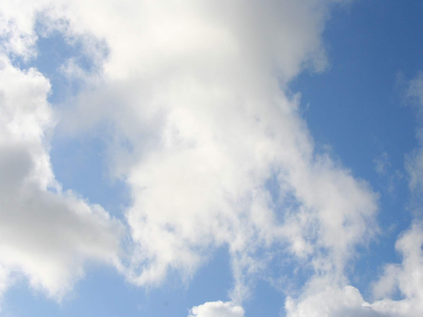 Thoughtful white clouds in a blue sky - just lie back in your mind, destress and relax!